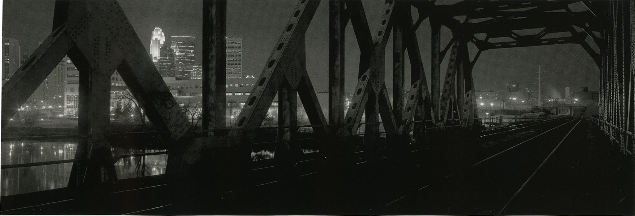 Downtown Minneapolis, viewed from the Soo Line Bridge, in Chris Faust's "Nocturnes" — a collection of panoramic, black-and-white nightscapes by the St. Paul photographer.
