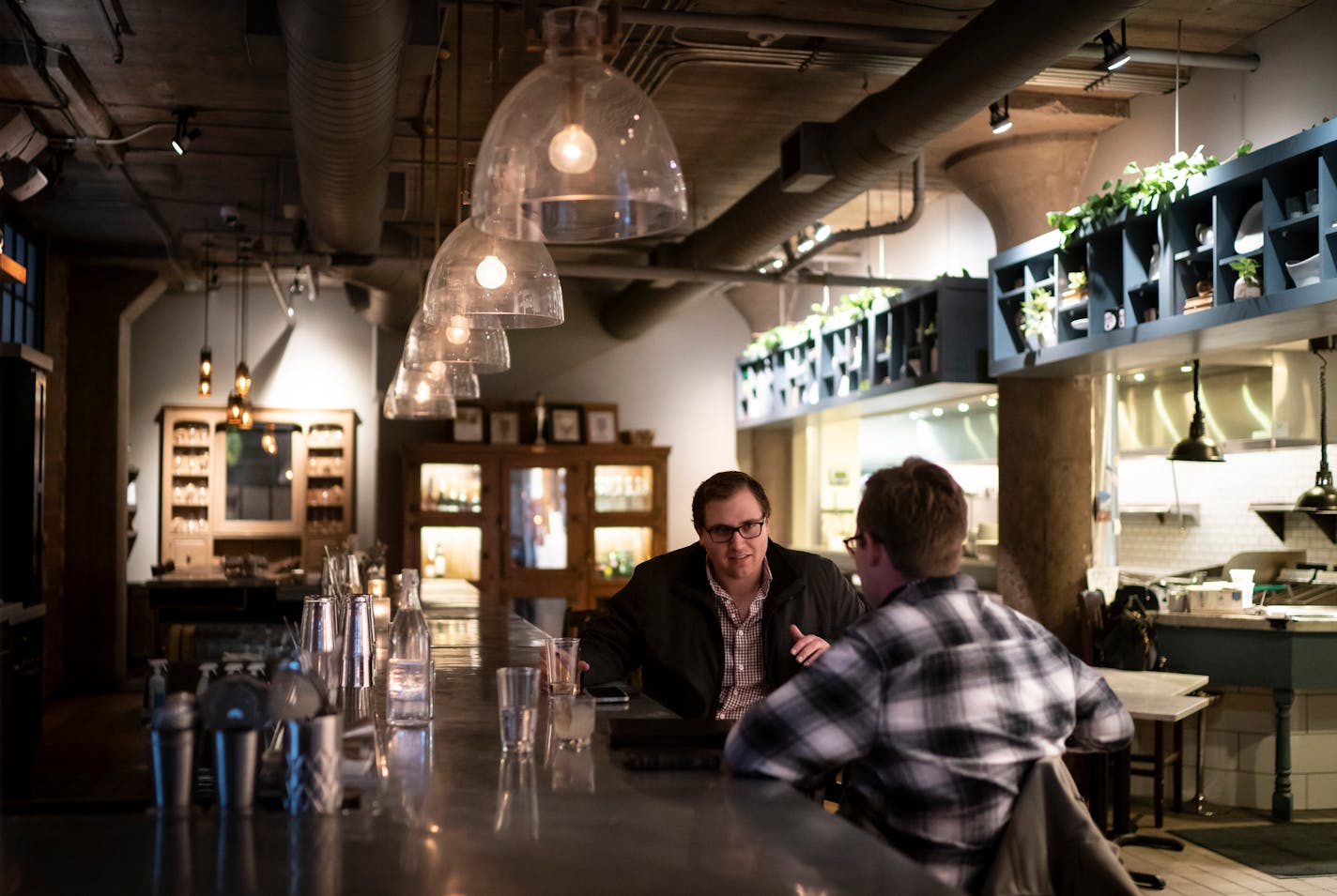 Colleagues Cole Sundquist, of St,. Louis Park, and Dalton Cook, of Minneapolis, had drinks at Borough in Minneapolis, Minn., on Wednesday, March 10, 2021. The two had not seen each other in three months and decided to come in to work and have a drink afterwards. ÒItÕs nice to see things starting to open up,Ó said Sundquist.