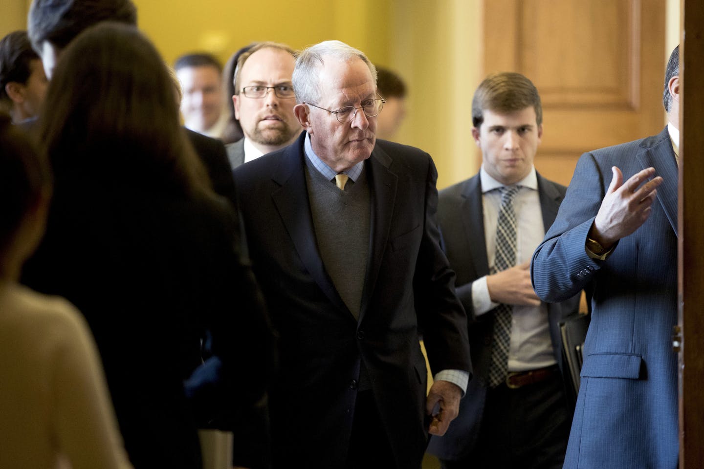 Sen. Lamar Alexander, R-Tenn., center, leaves a Senate policy luncheon on Capitol Hill in Washington, Tuesday, Oct. 17, 2017, after he and Sen. Patty Murray, D-Wash., say they have the "basic outlines" of a bipartisan deal to resume payments to health insurers that President Donald Trump has blocked. (AP Photo/Andrew Harnik)