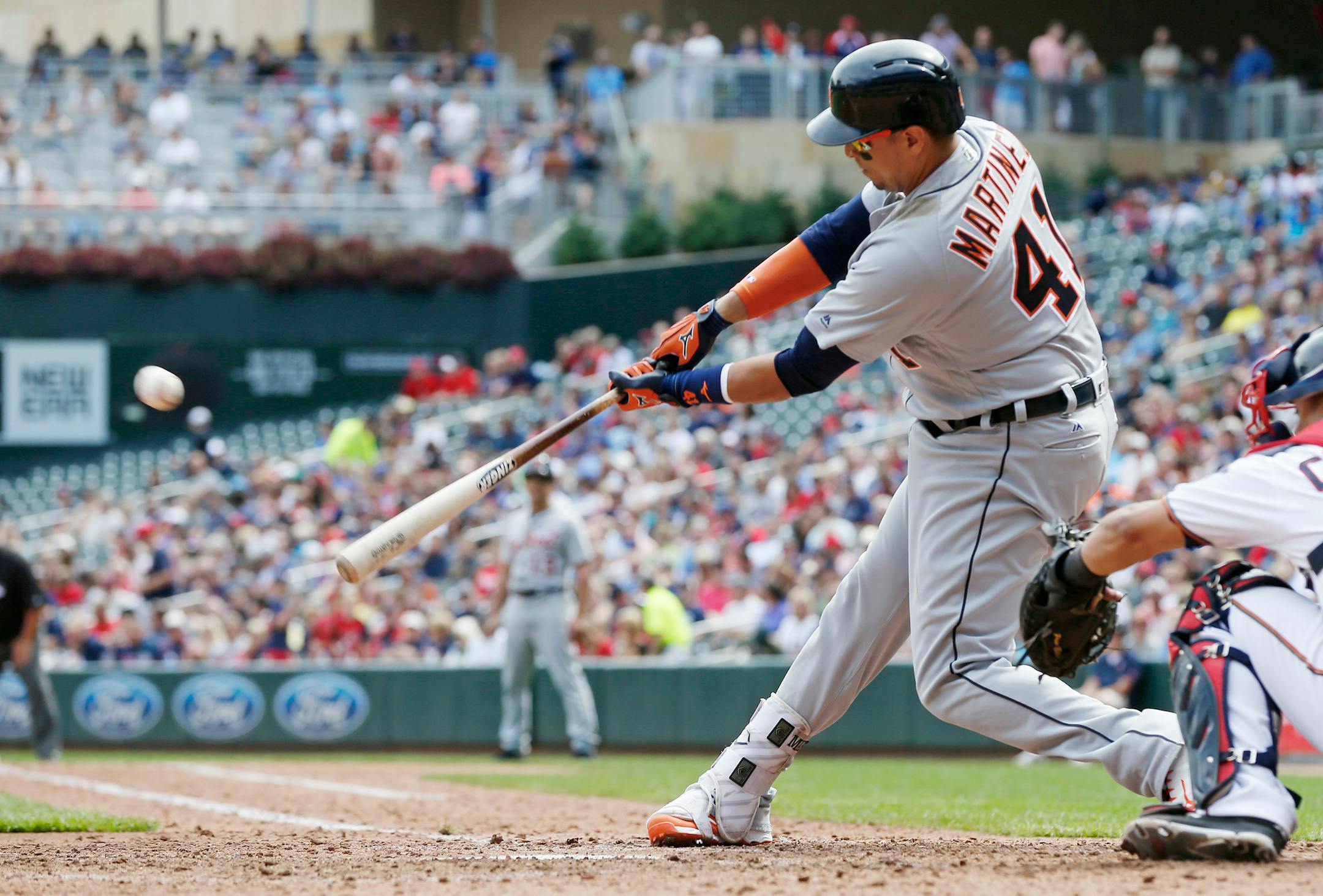 Detroit Tigers' Victor Martinez hits a two-run double off Minnesota Twins pitcher Michael Tonkin in the sixth inning of a baseball game Thursday, Aug. 25, 2016, in Minneapolis. (AP Photo/Jim Mone)