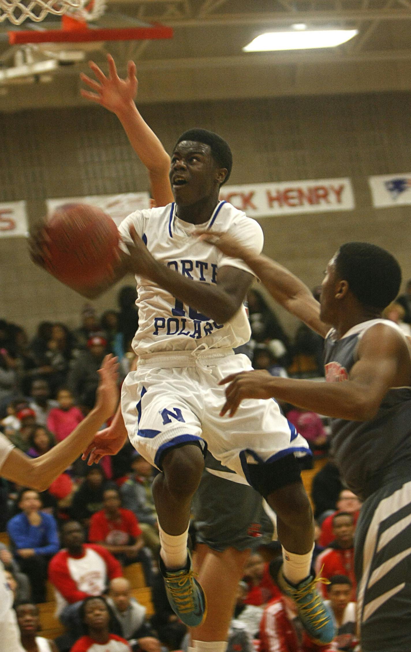 Minneapolis North forward Tyler Johnson takes the ball to the hoop during the first half of the Polars 83-70 victory at Minneapolis Henry on Friday, January 10. ] Chris Kelleher, Special to the Star Tribune, 1/10/2014, Minneapolis, Minn. EXTRA INFO: 20032636A_PREP011114