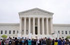 Demonstrators protest outside the Supreme Court after a draft opinion was leaked that overturns Roe v. Wade.