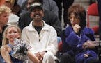 Prince, right, often attended Lynx and Wolves games at Target Center -- and, last October, threw a memorable party for the Lynx at Paisley Park after 