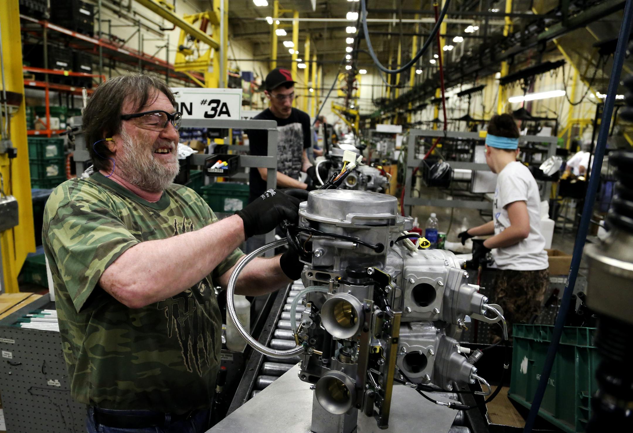 Arctic Cat employee Norman Olson prepares an engine for assembly in the XF 800 Artic Cat snowmobile at Arctic Cat's muanufacturing facility Wednesday, May 15, 2013 in Thief River Falls, MN. The snowmobile giant employs about 1,300 workers in Thief River Falls.](DAVID JOLES/STARTRIBUNE) djoles@startribune Pennington County is an island of growth in a sea of economic contraction in northwest Minnesota. Since 2000, job growth in the county has quadrupled population growth, making it an anomaly both