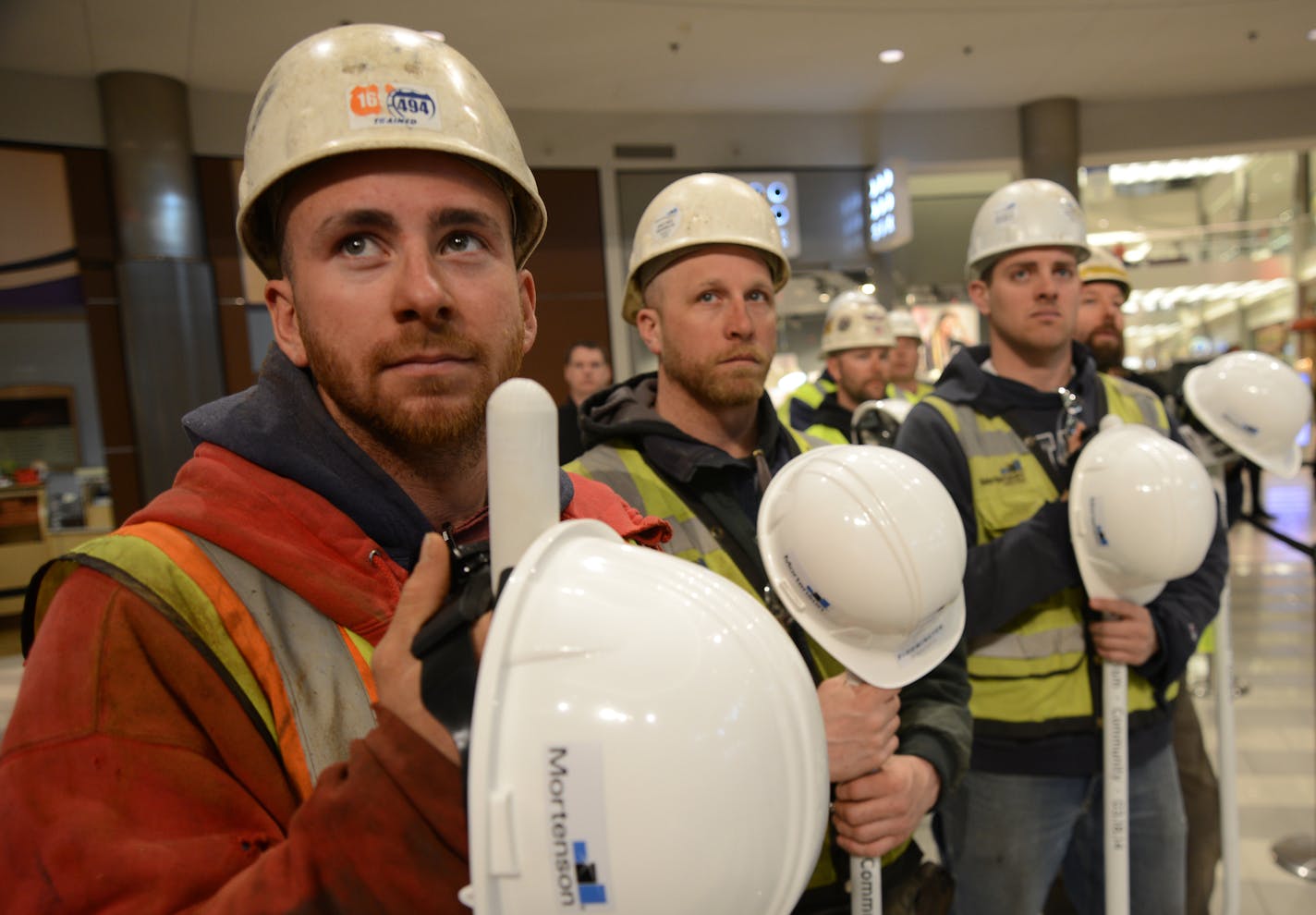 Mall of America's Phase II groundbreaking, was held in the MOA Rotunda these laborers and carpenters watched the ceremony and were waiting to get back to work on the job site. Over 1000 new construction jobs will be generated from building Mall of America's Phase II . ] Mall of America's Phase II groundbreaking Richard.Sennott@startribune.com Richard Sennott/Star Tribune Bloomington, Minn. Tuesday 3/18/2014) ** (cq)