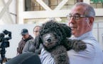 County Attorney Mike Freeman introduced the office's first ever emotional support animal, a golden doodle named Barrett. Barrett's trainer, Kathryn Ne