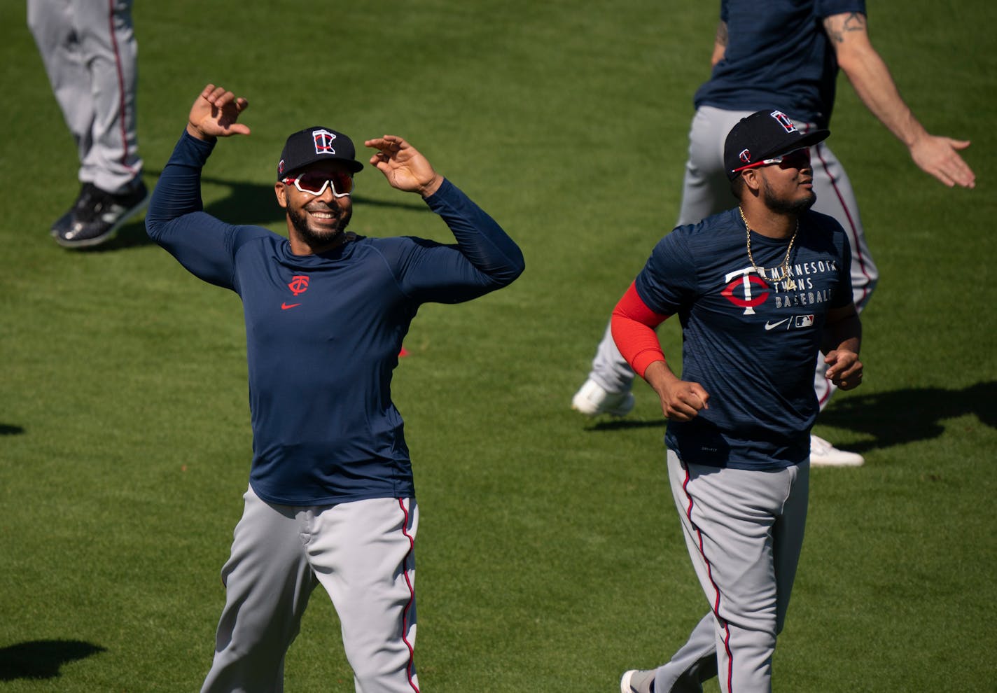 Twins designated hitter Nelson Cruz warmed up at the start of the first full squad workout. At right was infielder Luis Arraez. ] JEFF WHEELER • jeff.wheeler@startribune.com