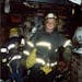 Guy Evers working his last fire for the Minneapolis Fire Department in 1999. He was a firefighter for 25 years.