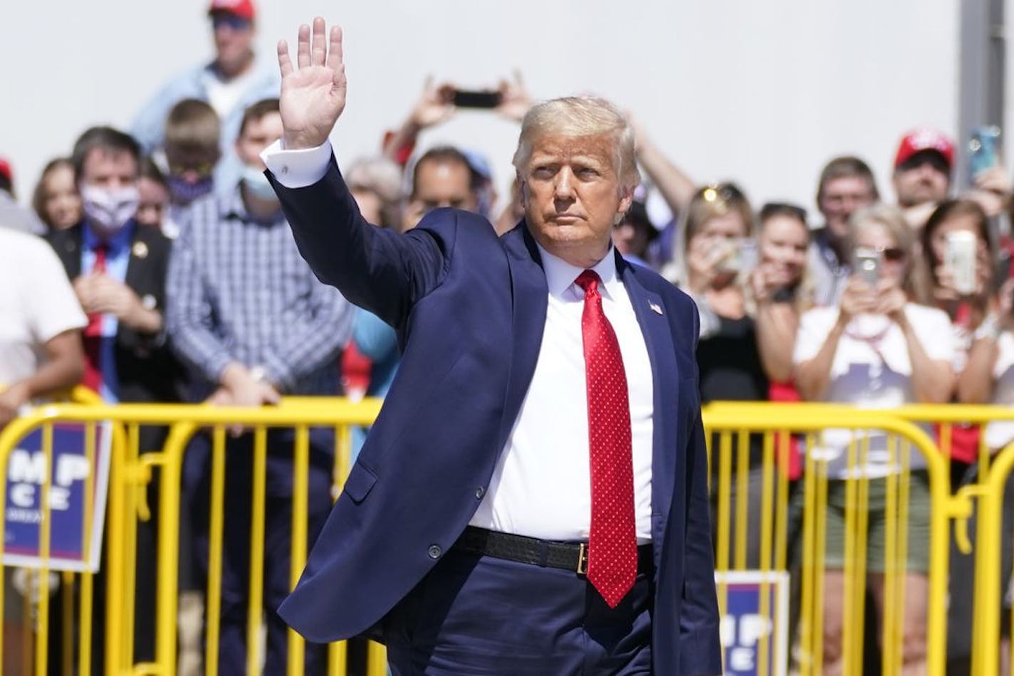 President Trump wraps up speaking to a crowd of supporters at the Minneapolis-St. Paul International Airport, Monday, Aug. 17, 2020, in Minneapolis.