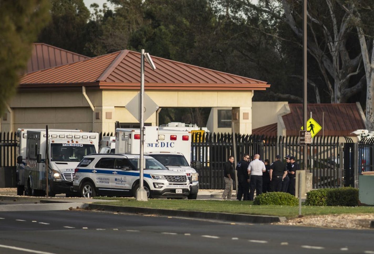 A group of ambulances from the Solano EMS Cooperative stage at the visitor center at Travis Air Force Base, adjacent to Fairfield, Calif., Sunday, Feb. 16, 2020. A group of Americans cut short a 14-day quarantine on the Diamond Princess cruise ship in the port of Yokohama, near Tokyo, to be whisked back to America. But they will have to spend another quarantine period at U.S. military facilities including Travis to make sure they don't have the new virus that's been sweeping across Asia.