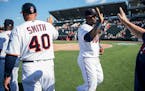 Twins players, including third baseman Miguel Sano (22), right of center, celebrated their 5-2 win over the Washington nationals.