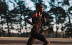 Eldoret, Kenya - Eliud Kipchoge runs into the rising sun during a training session at the University of Eldoret track in Eldoret, Kenya.