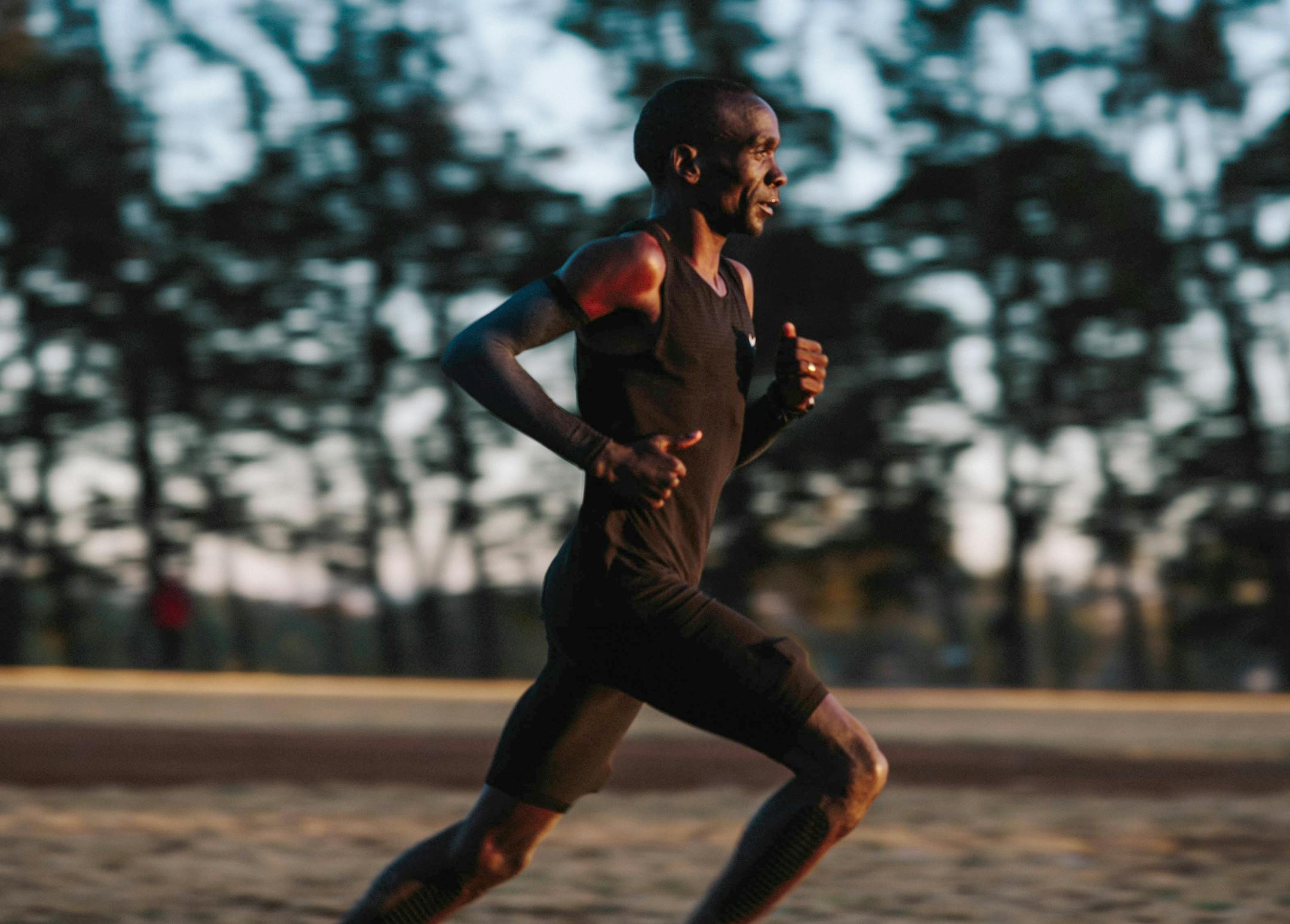 Eldoret, Kenya - Eliud Kipchoge runs into the rising sun during a training session at the University of Eldoret track in Eldoret, Kenya.