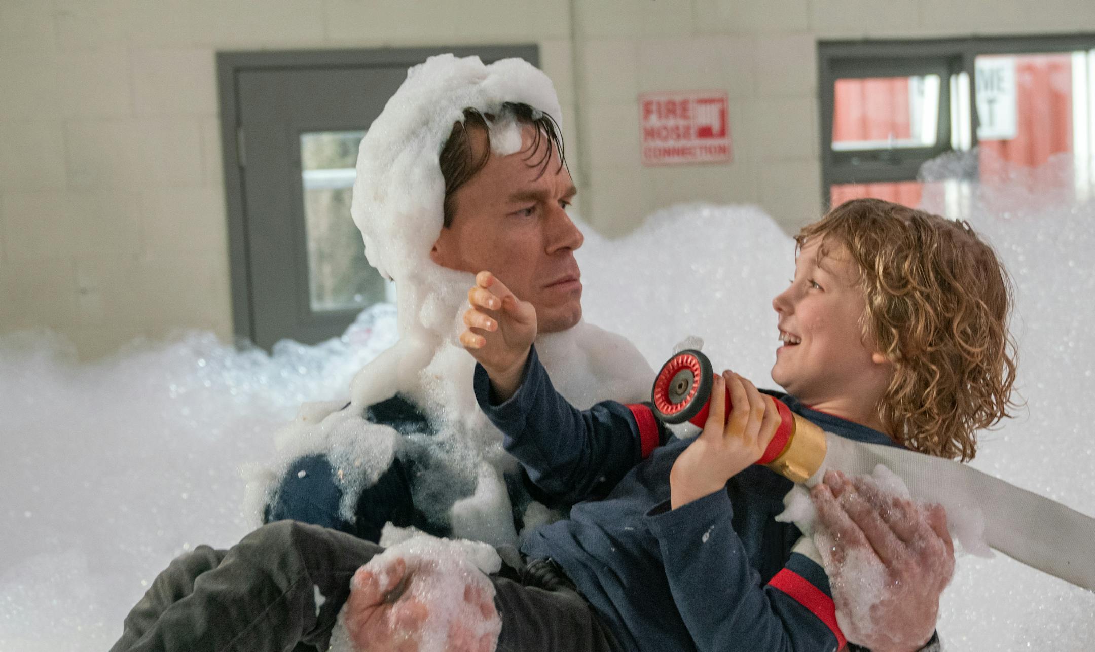 John Cena and Christian Convery in PLAYING WITH FIRE from Paramount Pictures. Photo Credit: Doane Gregory.