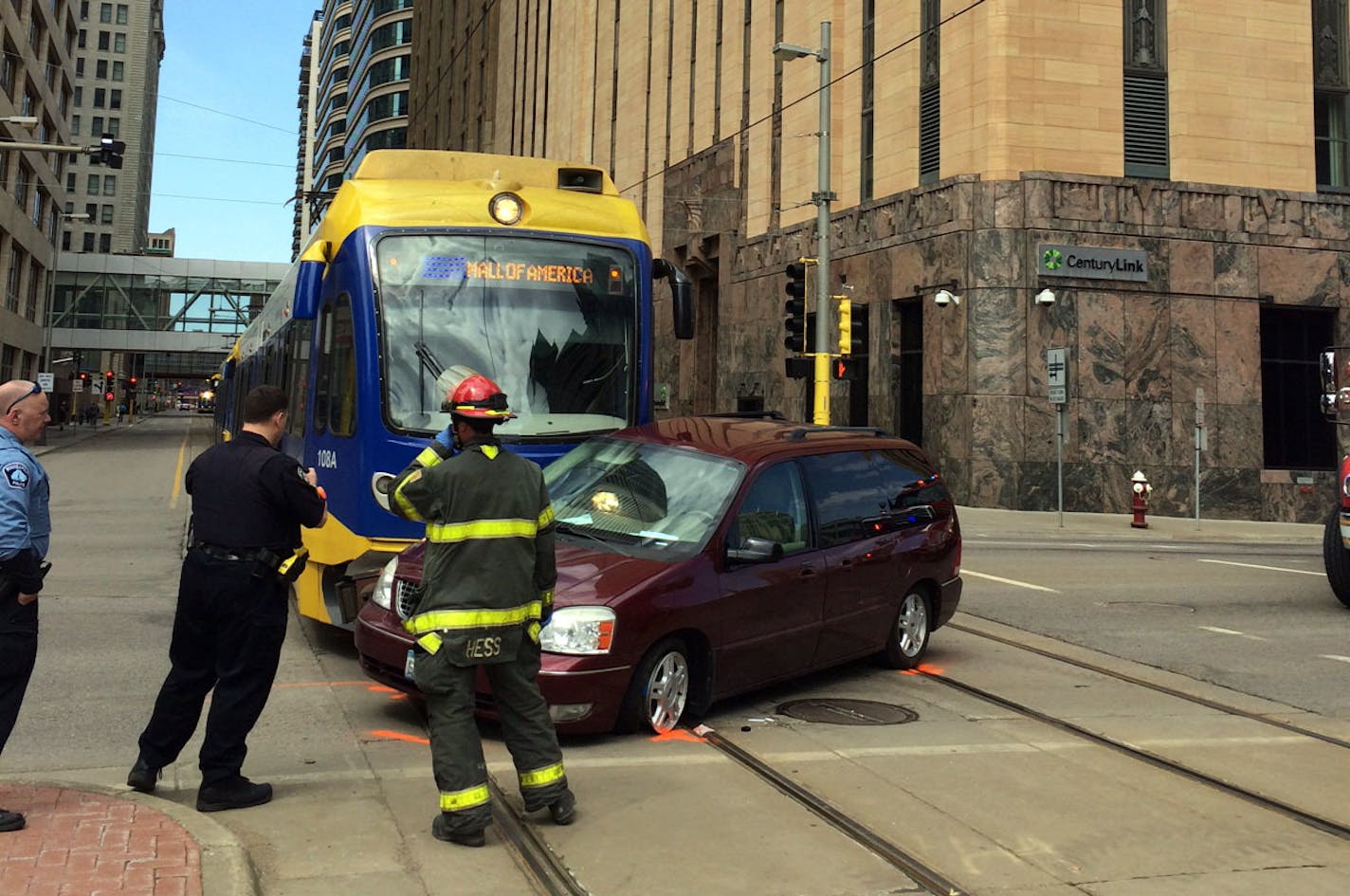 A light rail train struck a car Sunday afternoon, April 12, 2015, in downtown Minneapolis, leaving the tracks blocked. The collision occurred about 12:45 p.m. The car's driver, a man, did not appear to be seriously hurt. (Claude Peck, Star Tribune)