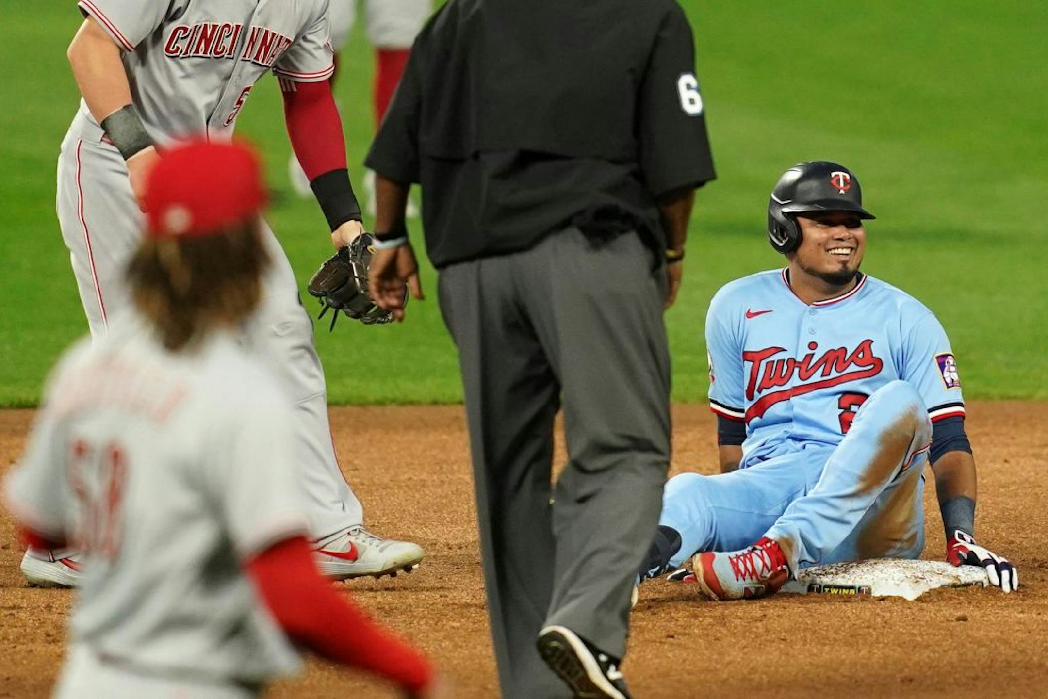 Minnesota Twins second baseman Luis Arráez (2) smiled as he slid safe into second for a double in the first inning.