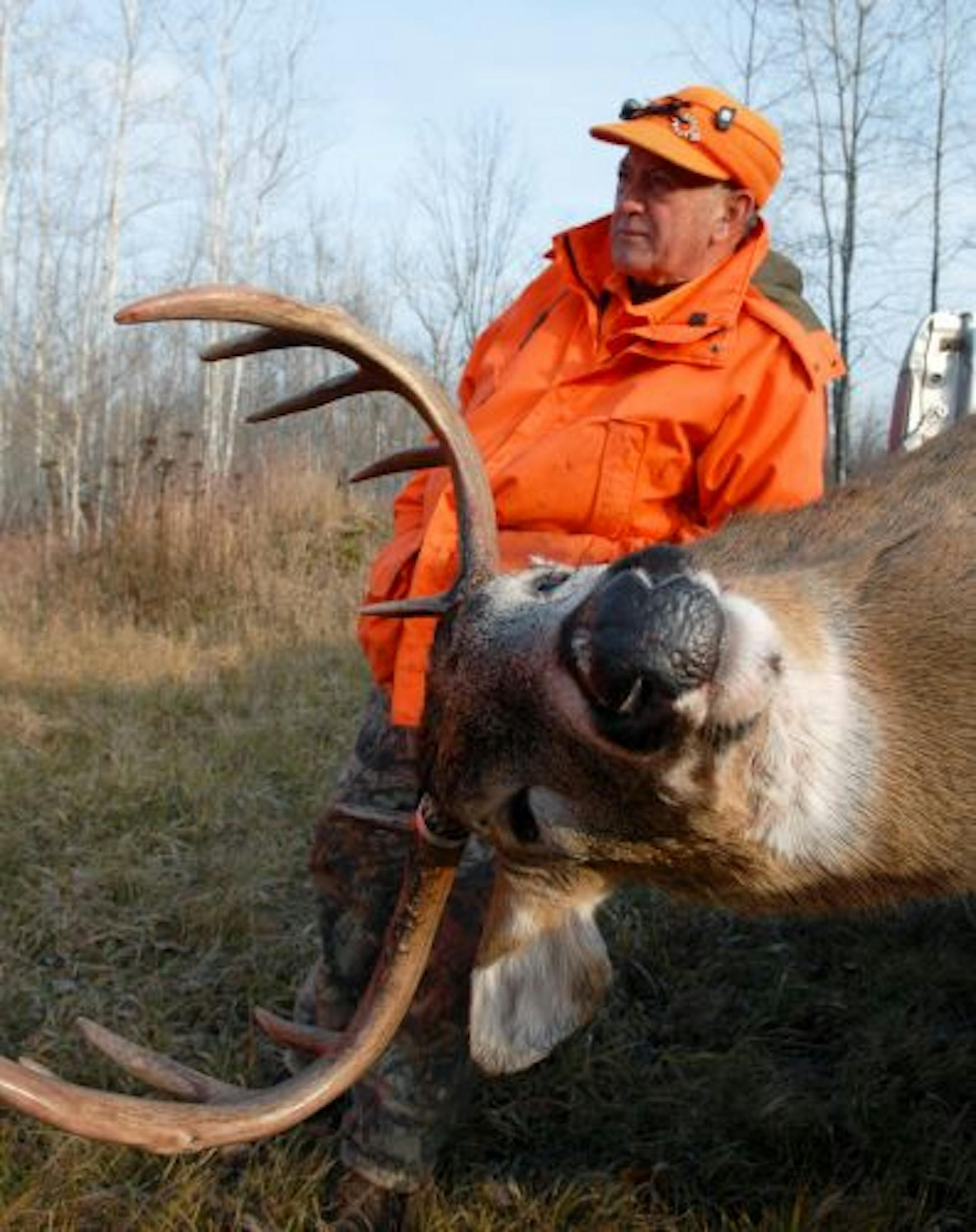 Norb Berg of Barronett, Wis., with a 10-point buck he shot at a few minutes after 7 a.m. Saturday, opening day of the Wisconsin deer season. The hefty 10-pointer was crossing a swamp.