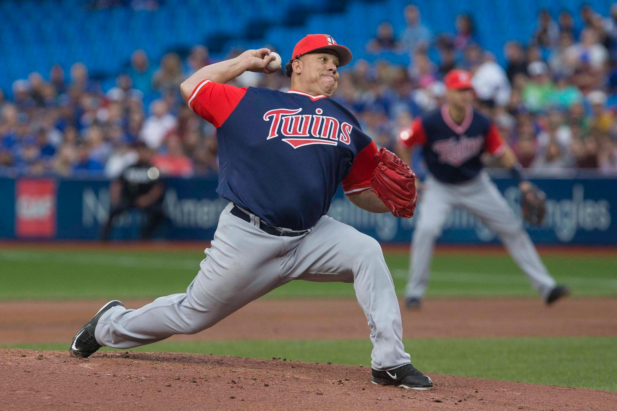 Minnesota Twins starting pitcher Bartolo Colon works against the Toronto Blue Jays during the first inning of a baseball game Friday, Aug. 25, 2017, in Toronto. (Chris Young/The Canadian Press via AP)