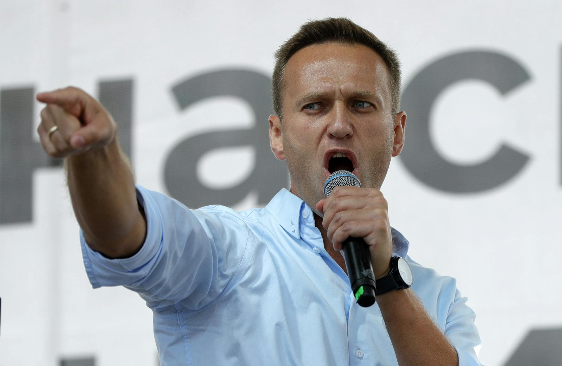 FILE - In this July 20, 2019, file photo, Russian opposition activist Alexei Navalny gestures while speaking to a crowd during a political protest in Moscow, Russia. The German hospital treating Russian opposition leader Alexei Navalny says he has been taken out of an induced coma and is responsive. German experts say Navalny, who fell ill Aug. 20 on a domestic flight in Russia, was poisoned with a substance belonging to the Soviet-era nerve agent Novichok. (AP Photo/Pavel Golovkin, File)