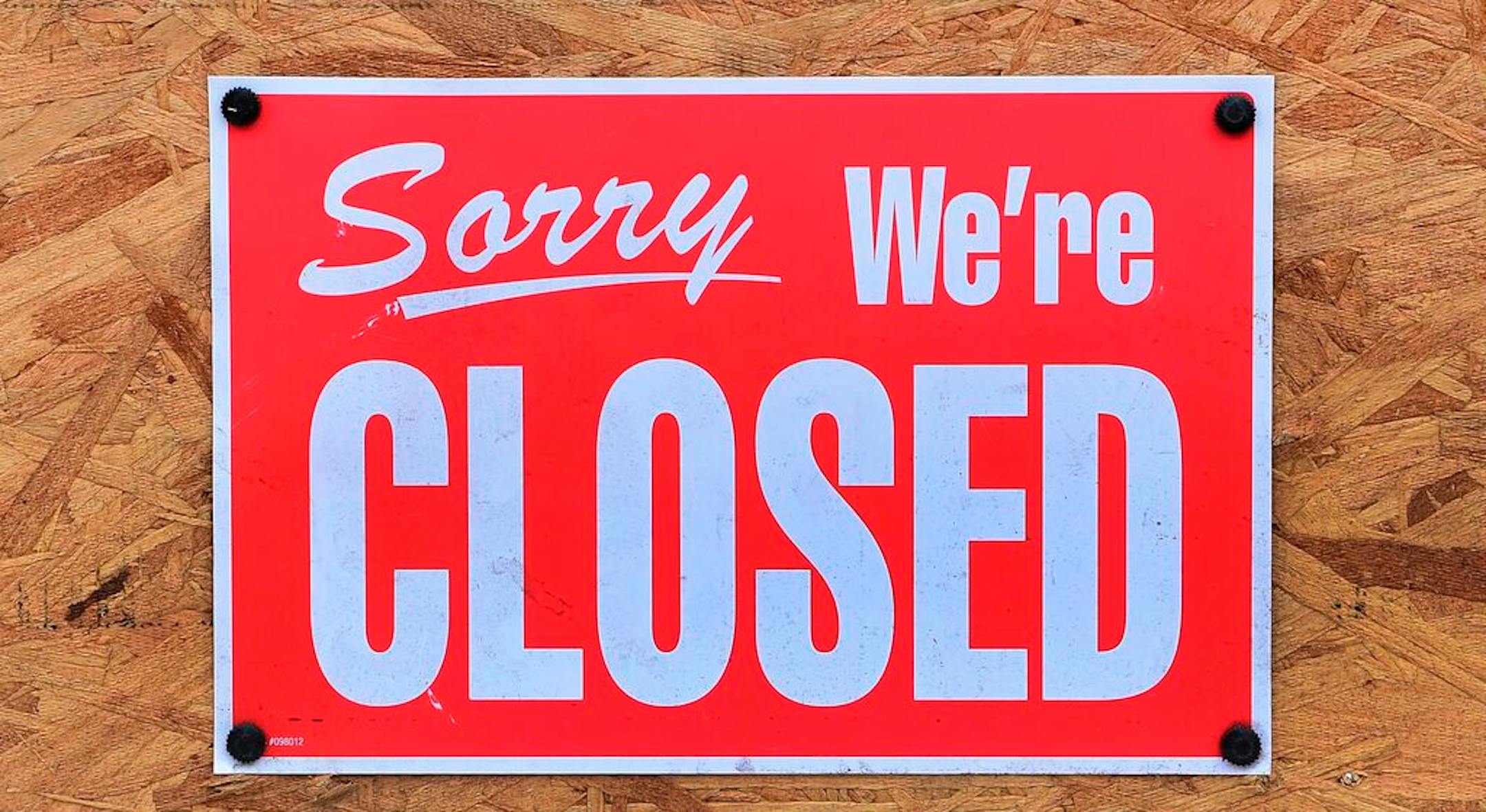 A "Closed" sign is seen amid the ccoronavirus pandemic in Los Angeles on Dec. 5, 2020. (Frederic J. Brown/AFP/Getty Images/TNS) ORG XMIT: 7774531W