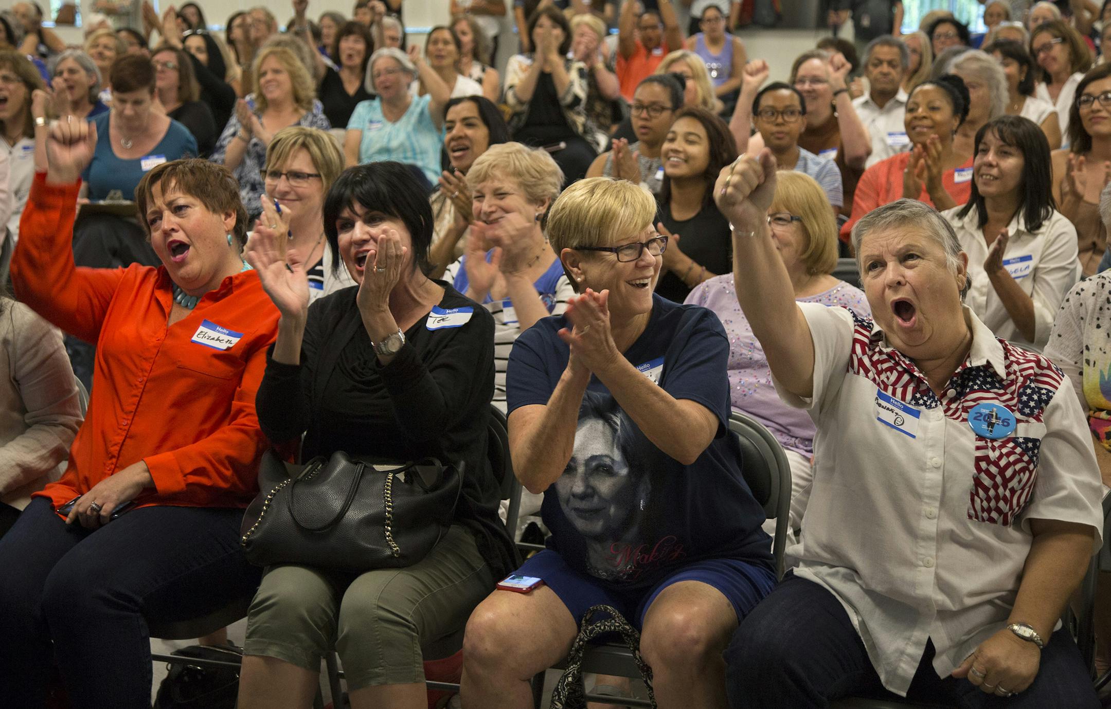 Attendees cheered during a Democratic women’s rally in Phoenix, Ariz.