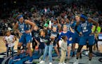 The Lynx players, including forward Napheesa Collier, left, did a post-game victory dance with young fans after a game in 2019.