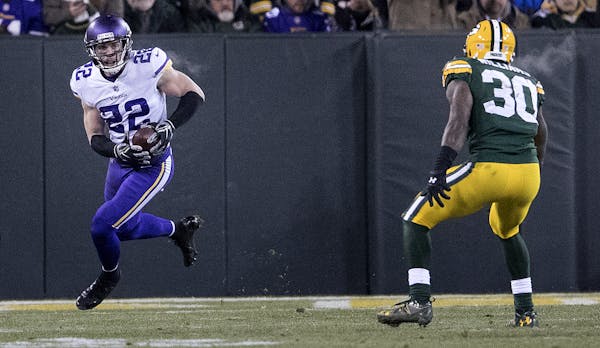 Minnesota Vikings defensive back Harrison Smith (22) intercepts a pass against the Green Bay Packers in the second quarter on Saturday, Dec. 23, 2017,
