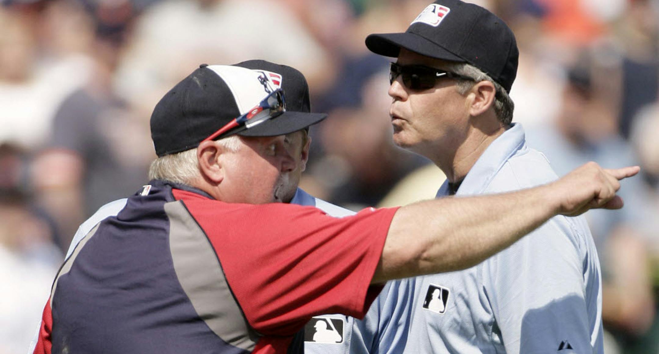 The Twins' Ron Gardenhire, left, argued with third base umpire Gary Darling after Alex Avila doubled and the ball appeared to hit a fan. The umpires ruled the go-ahead run could score.