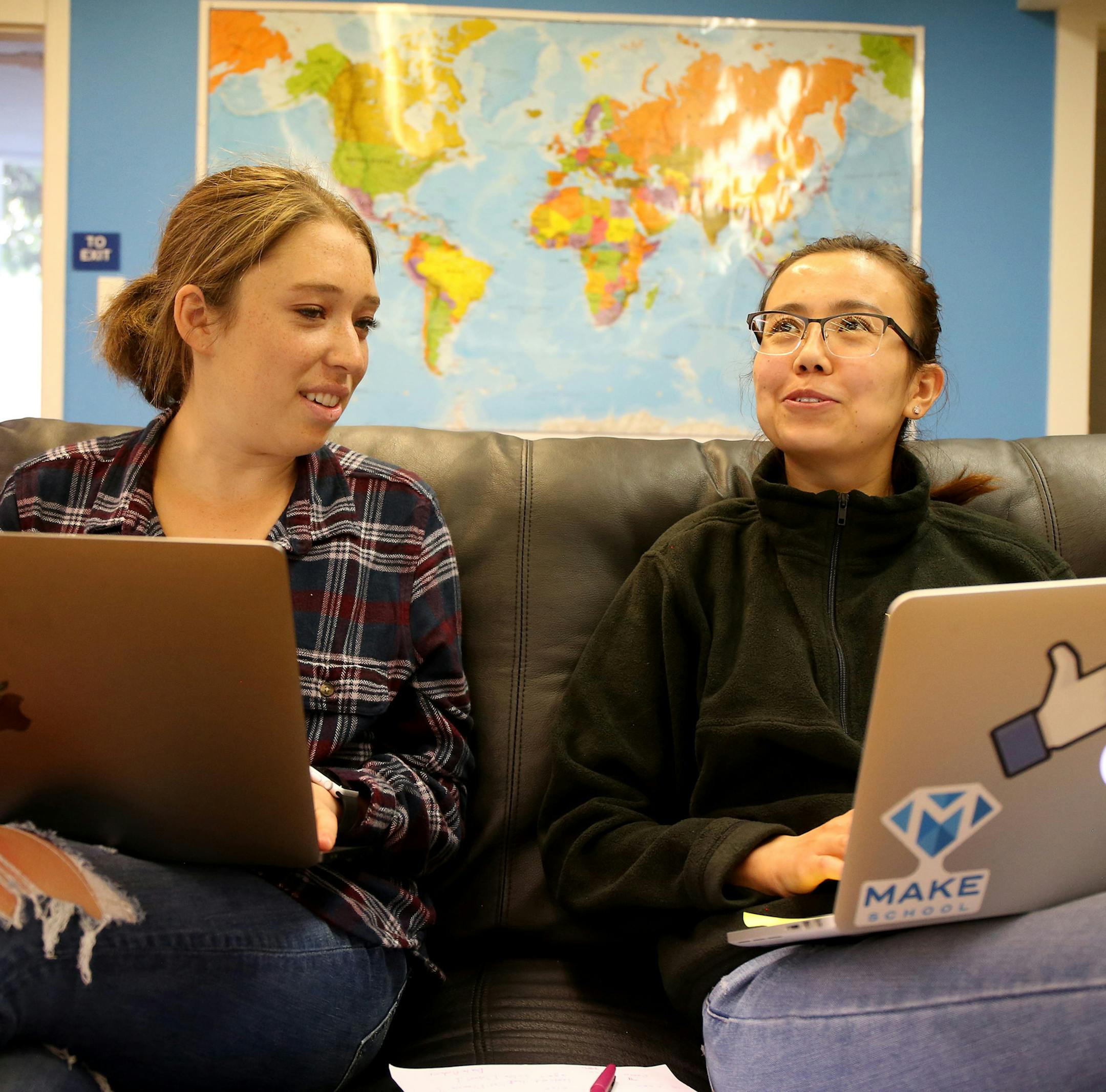 Make School student Lauren Weiss, 18, left, gets feedback from instructor Karlygash Zhuginissoova, 25, as she works on a health app as part of her project at the school in San Francisco, Calif., on Wednesday, July 12, 2017. (Ray Chavez/Bay Area News Group/TNS)