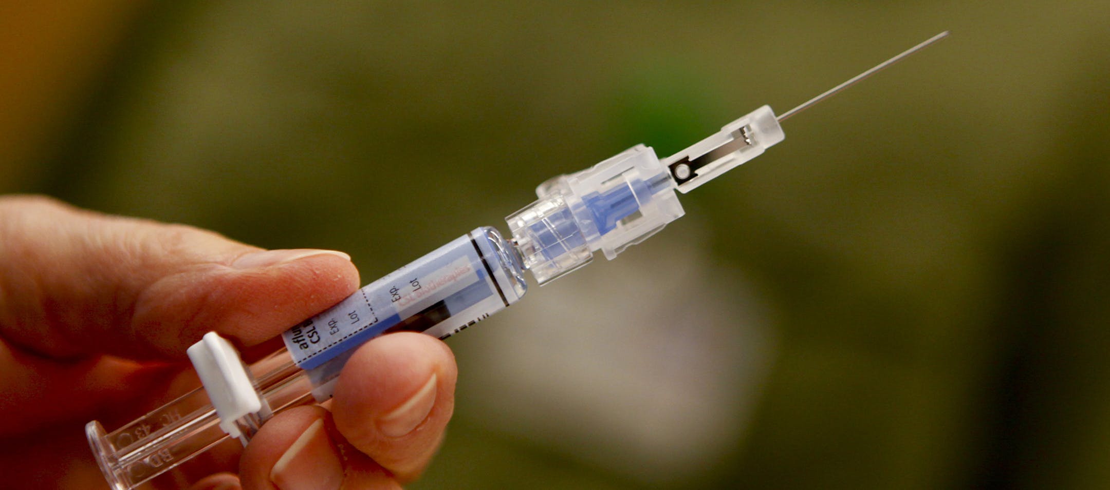 Downey Regional Medical Center RN Connie Meinke holds a syringe filled with the flu vaccine before injecting a fellow employee on January 17, 2013. Like many hospitals across the U.S., the Downey, California, facility is preparing for the flu onslaught. The hospital is asking all of their employees to be vaccinated. (Mark Boster/Los Angeles Times/MCT) ORG XMIT: 1133860