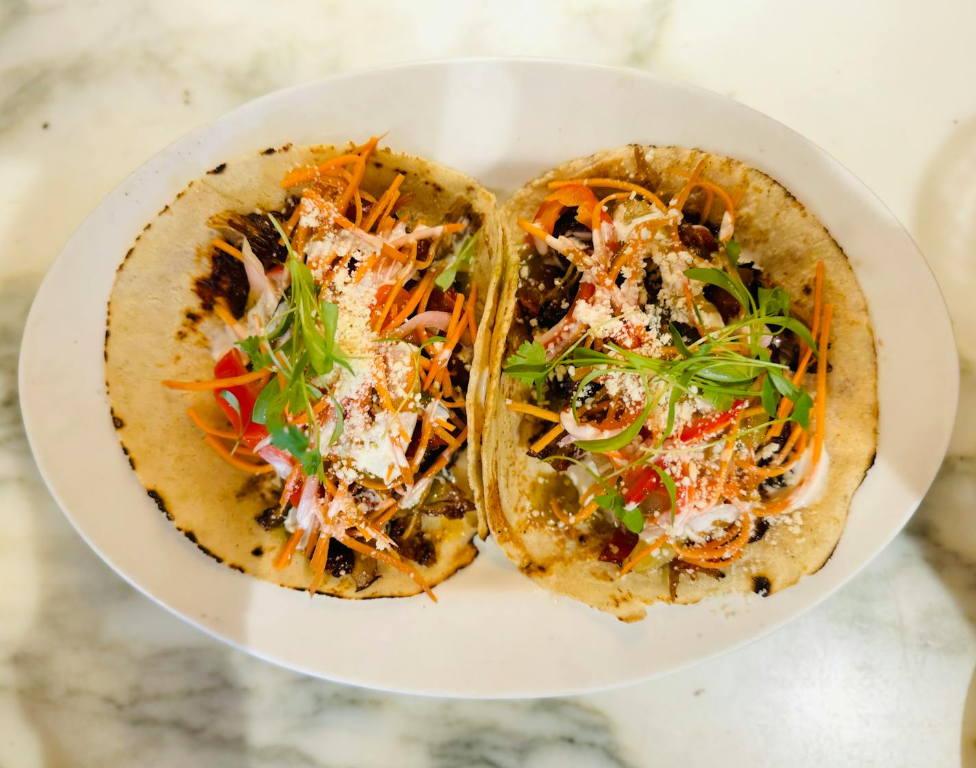 Duck tacos with an all the colors of the rainbow slaw at The Harriet Brasserie in Minneapolis' Linden Hills.