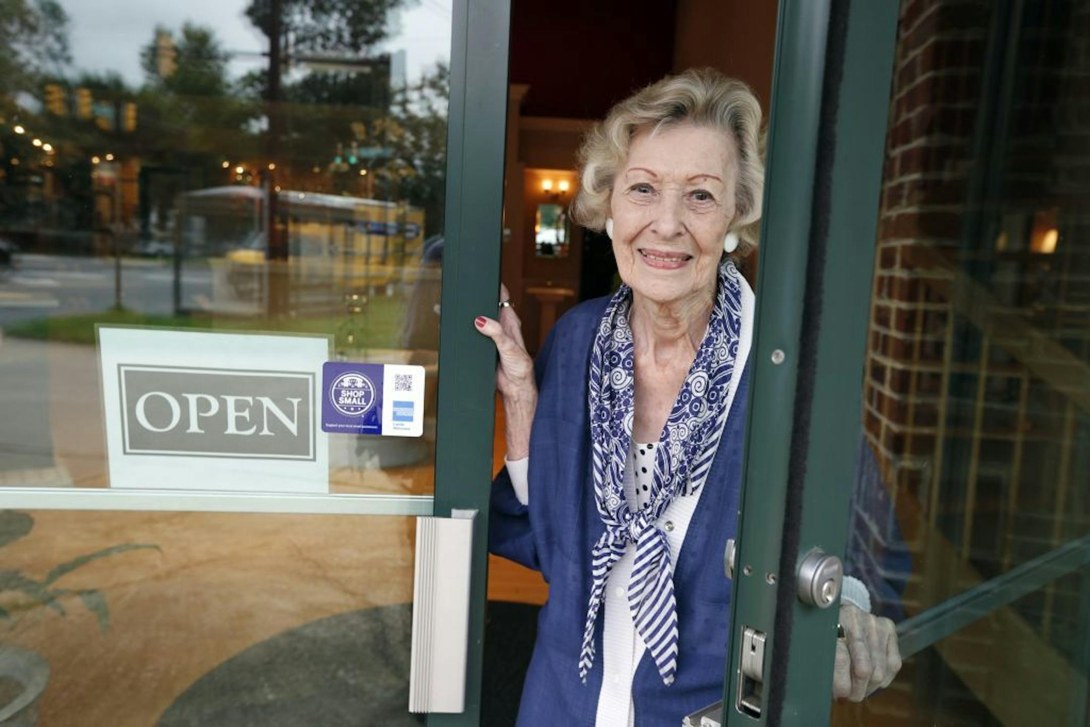 June Springer, poses for a photograph, where she works at Caffi Contracting Services, Friday, July 12, 2013 in Alexandria, Va. Springer who just turned 90, works as a receptionist. People who delay retirement have less risk of developing Alzheimer's disease or other types of dementia, a study of half a million people in France found.