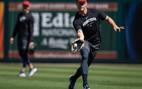 Max Kepler chases down a ball during Twins spring training on Feb. 21.