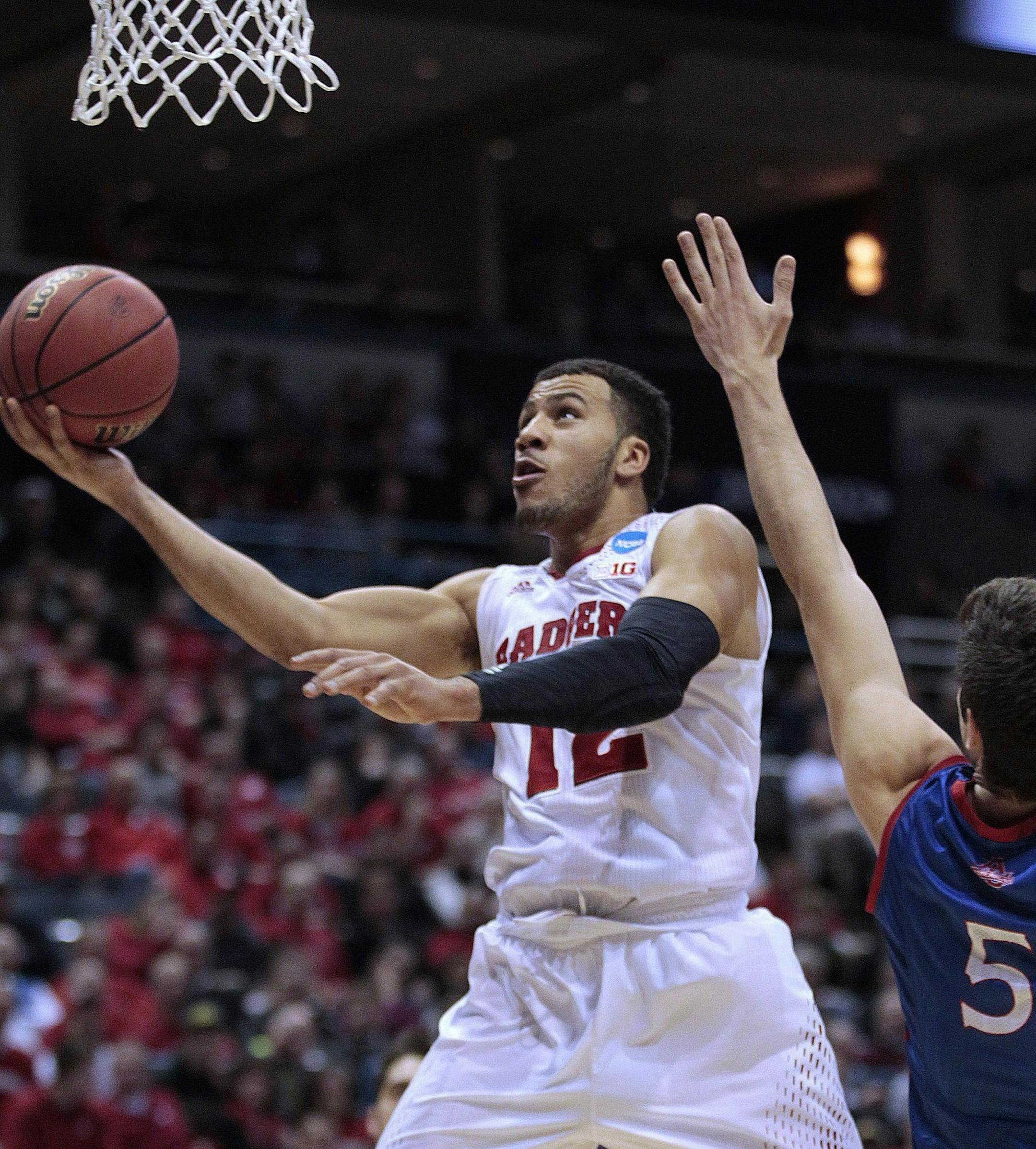 Badgers guard Traevon Jackson easily scored past American guard Marko Vasic in the second round of the NCAA men's basketball tournament.