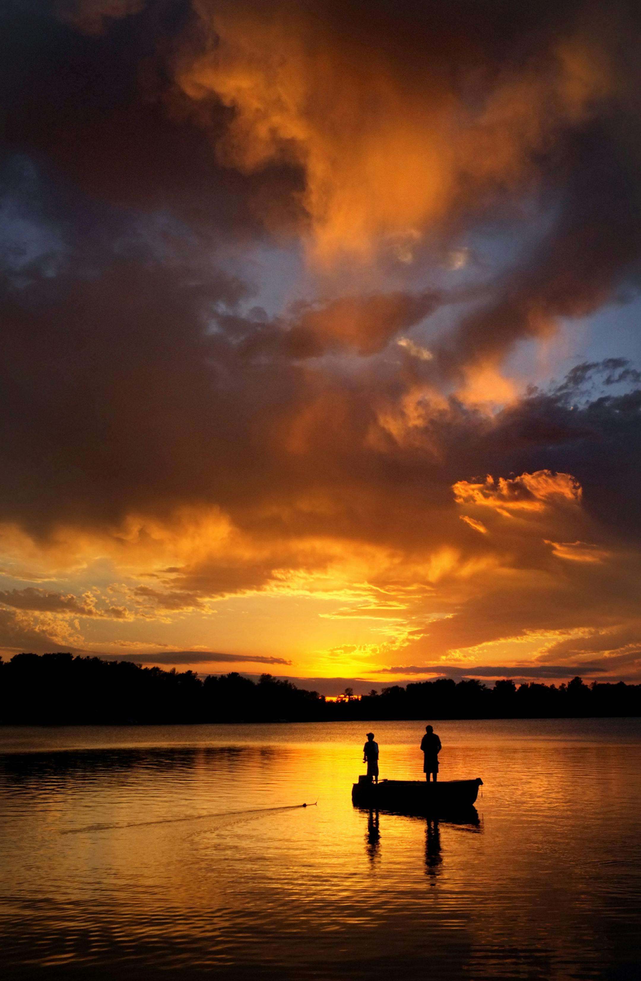 Brendan Peterson and Tyler Grondseth try their luck on a hot fishing hole on Lake Elora in Northern Minnesota. ] BRIAN PETERSON ‚Ä¢ brian.peterson@startribune.com Canyon, MN 5/20/2014