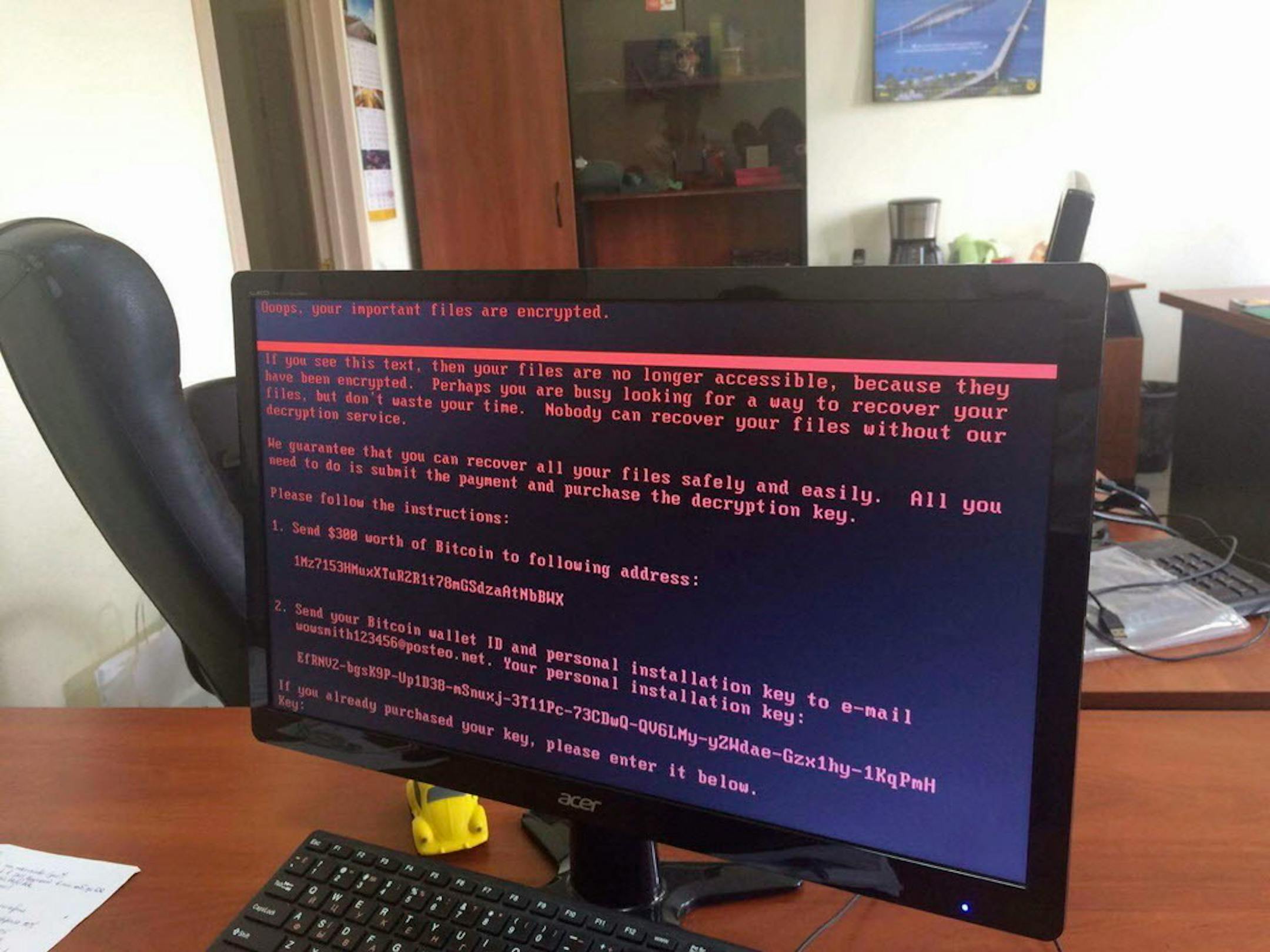 A computer screen cyberattack warning notice reportedly holding computer files to ransom, as part of a massive international cyberattack, at an office in Kiev, Ukraine, Tuesday June 27, 2017, A new and highly virulent outbreak of malicious data-scrambling software appears to be causing mass disruption across Europe, hitting Ukraine especially hard. Image used with permission of the account holder facebook.com/olejmaa checked and consistent with independent AP reporting. (Oleg Reshetnyak via AP)