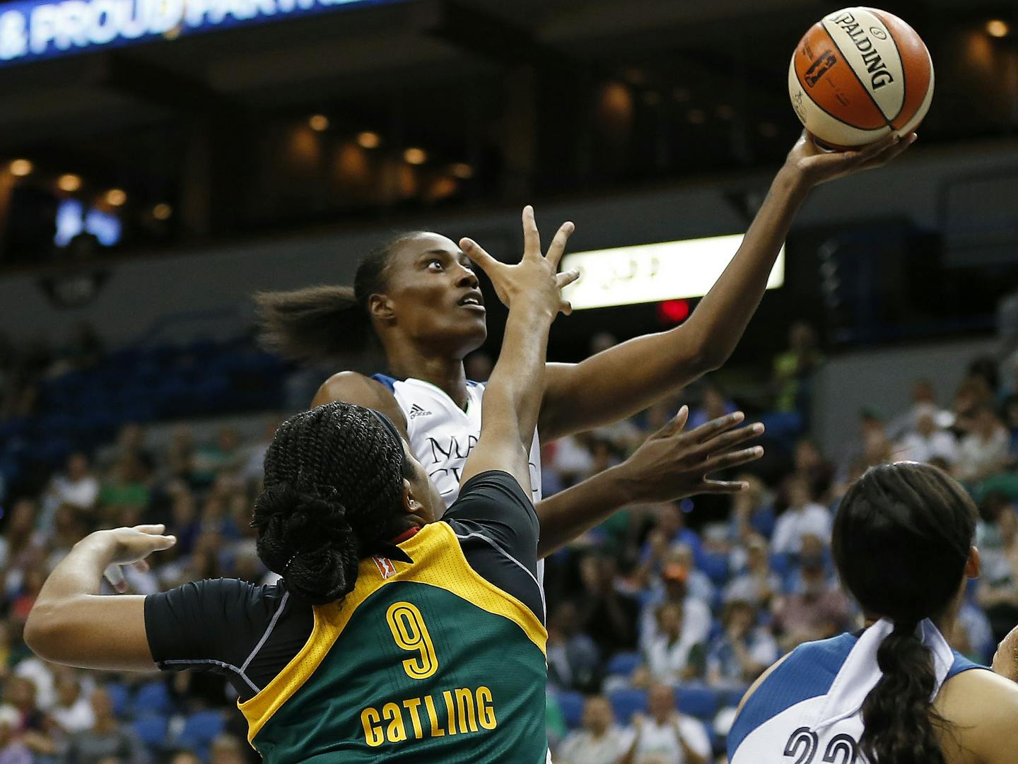 Minnesota Lynx center Sylvia Fowles, center, shoots in front of Seattle Storm center Markeisha Gatling (9) during the first half of a WNBA basketball game, Tuesday, Sept. 8, 2015, in Minneapolis. (AP Photo/Stacy Bengs) ORG XMIT: MIN2015091617571149