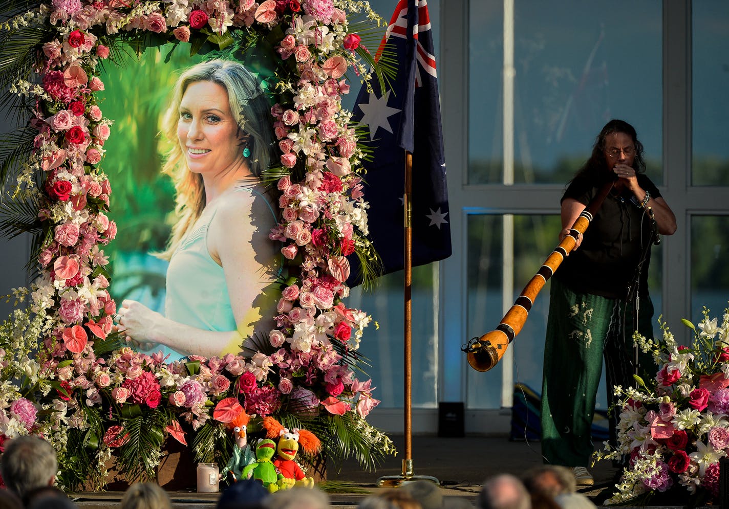 Johanna Morrow was one of two musicians to play the didgeridoo during Justine Damond's memorial ceremony at Lake Harriet in Minneapolis on Friday, Aug. 11, 2017. Harriet Bandshell in Minneapolis, Minn. Justine Damond was killed by Minneapolis police on July 15. (Aaron Lavinsky/Minneapolis Star Tribune/TNS)