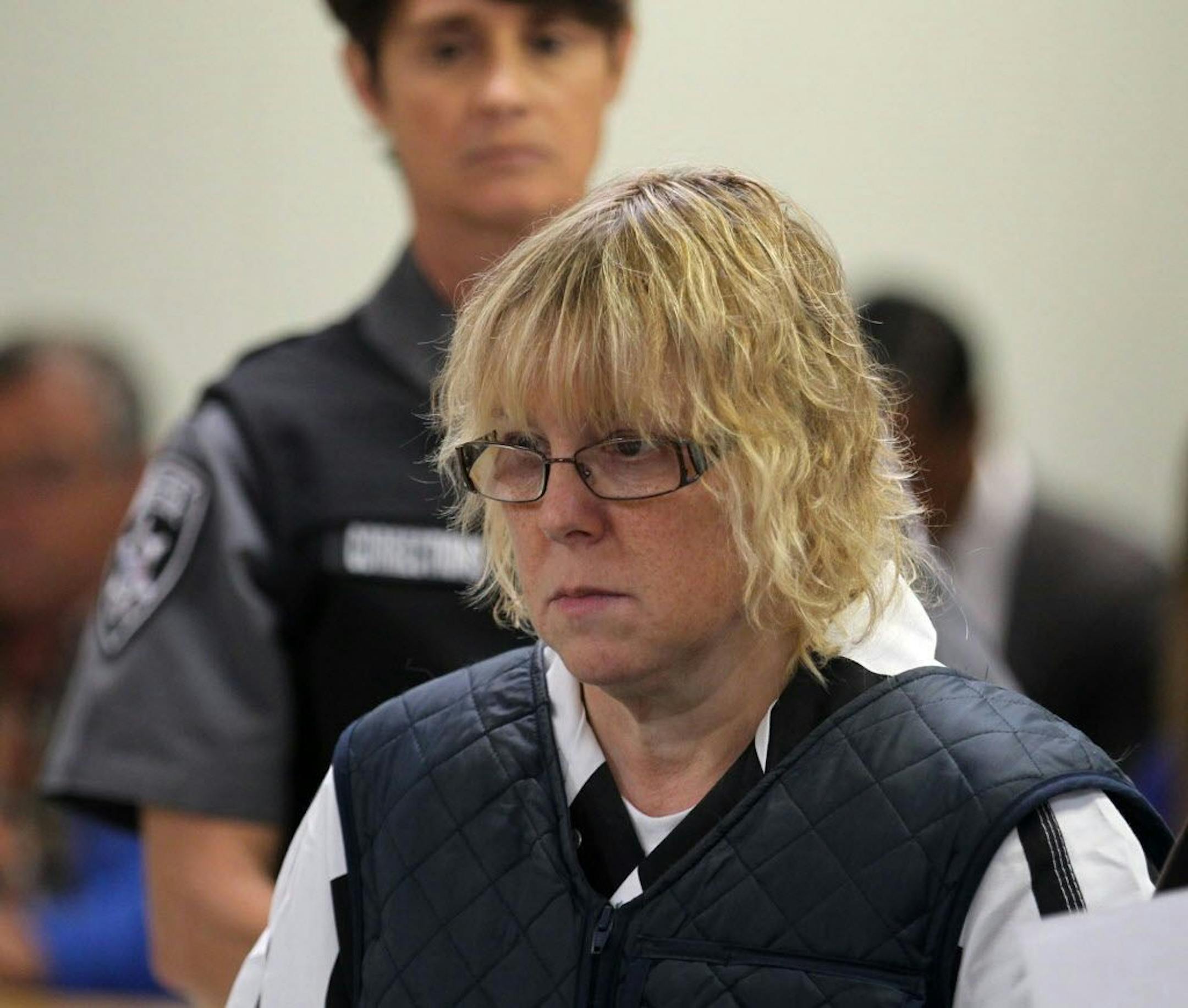 FILE - In this June 15, 2015, file photo, Joyce Mitchell appears before Judge Mark Rogers in Plattsburgh, N.Y., City Court for a hearing.