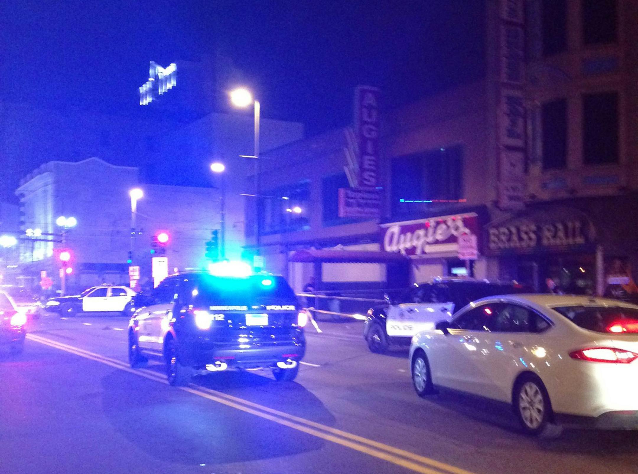 Police respond to the scene of a fatal shooting on Oct. 18, 2014, at Augie's in downtown Minneapolis.