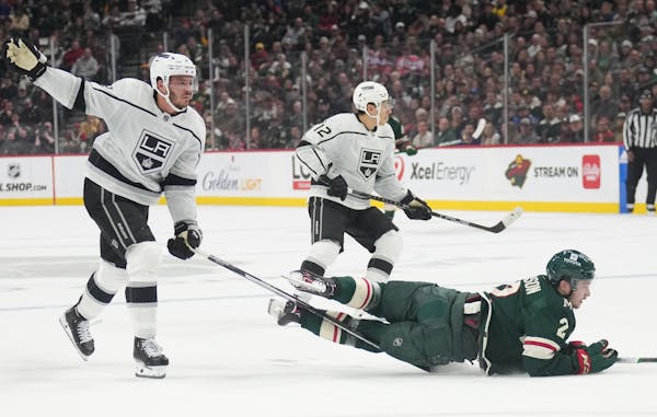Los Angeles Kings defenseman Matt Roy (3) and Minnesota Wild defenseman Calen Addison (2) got tangled up in the first period of the Wild’s 7-3 loss.