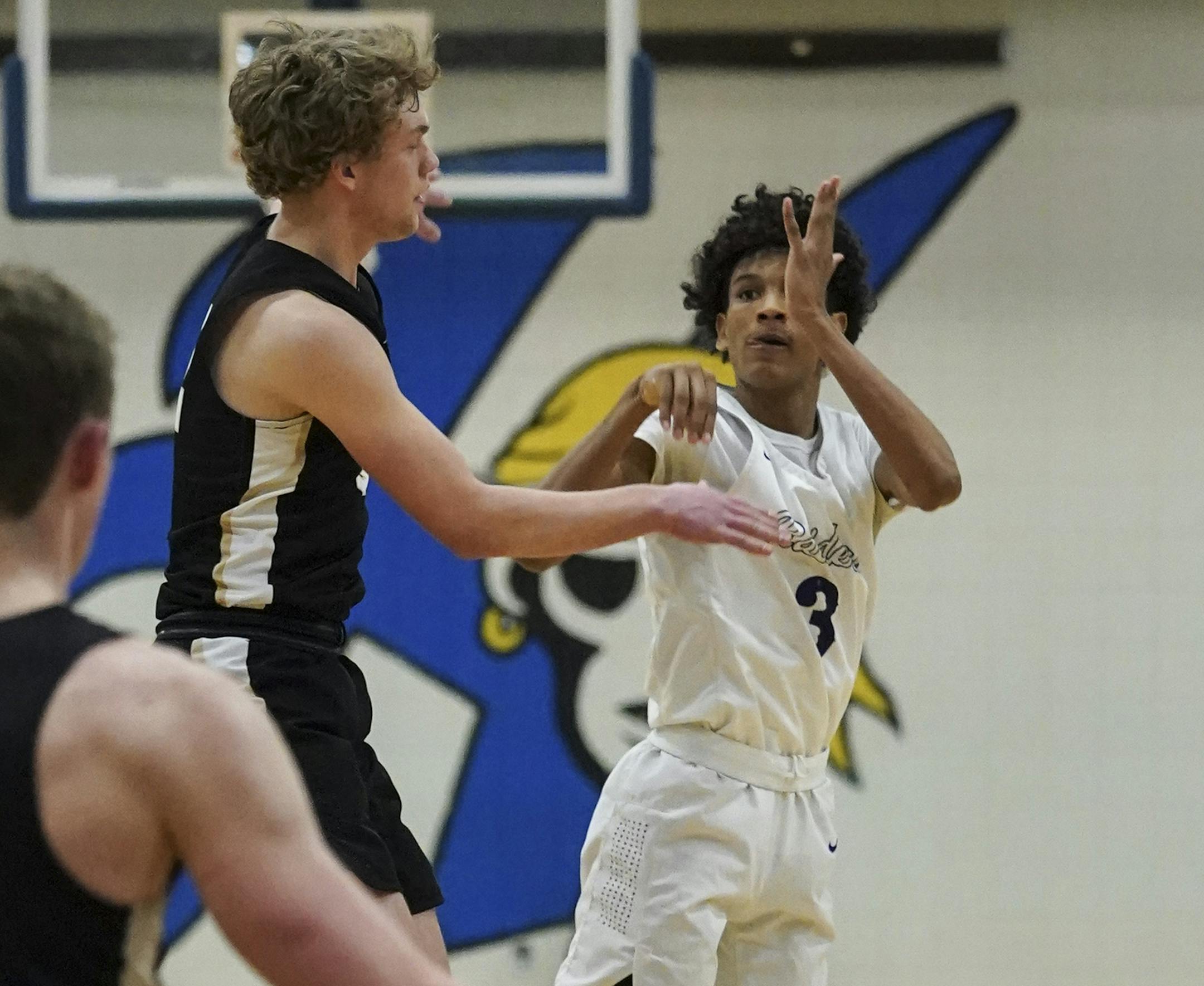 Cretin-Derham Hall guard Curtis Jones (3) shot a three-point shot to win the game in the final second of the second half. ] RENEE JONES SCHNEIDER ¥ renee.jones@startribune.com East Ridge High School vs. Cretin-Derham Hall in the boys basketball Class 4A, Section 4 final at Hastings High School, Minn., on Thursday, March 12, 2020.