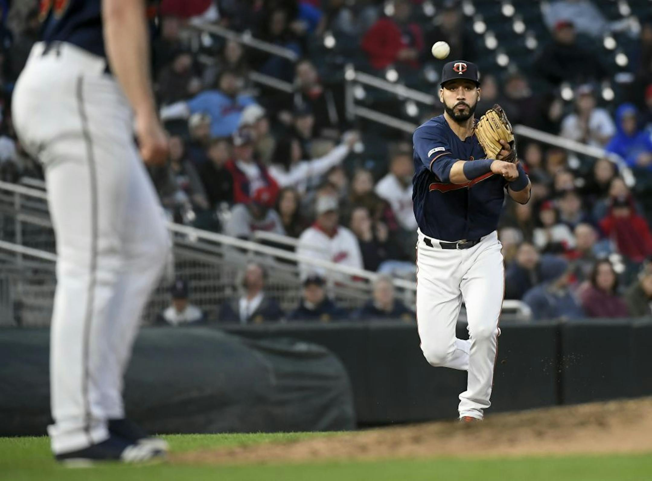 Minnesota Twins third baseman Marwin Gonzalez (9) threw to ball to first base for an out off a ground ball hit by Detroit Tigers catcher Grayson Greiner (17).