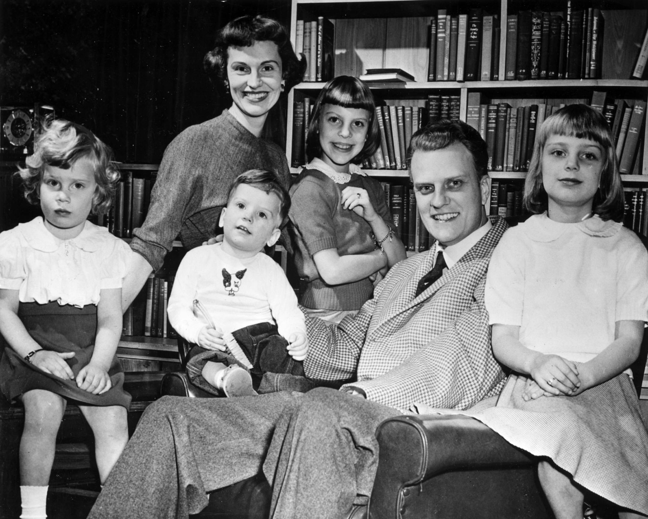 Preacher and evangelist Billy Graham, his wife Ruth Graham, and their family pose for a portrait. Children shown left to right are daughter Ruth, Franklin, Virginia, and Ann. Photo received in the Minneapolis Star & Tribune library September 1955. Ran 28 years later, Sept. 25, 1983.
