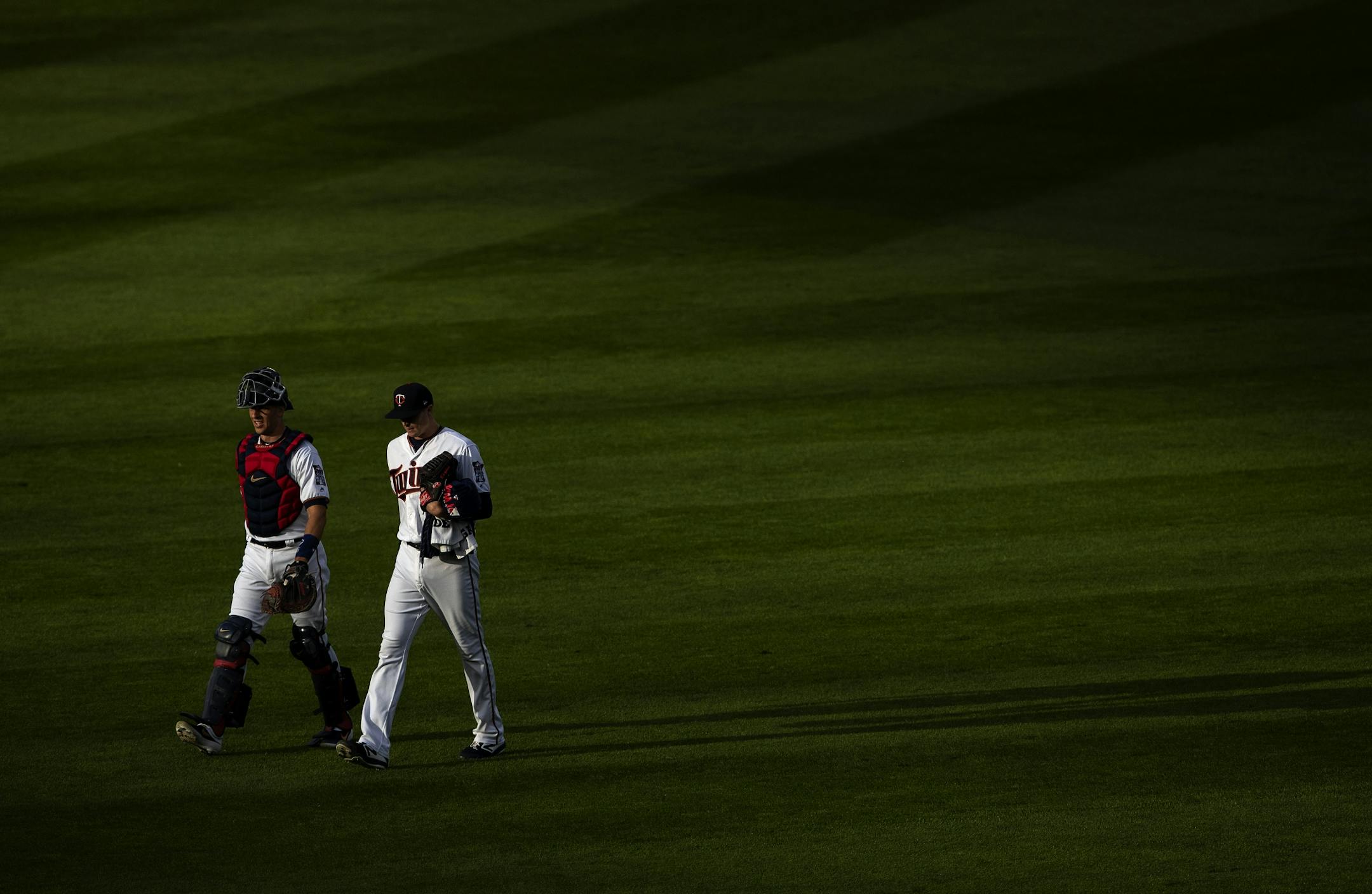 Twins catcher Jason Castro and starting pitcher Kyle Gibson walked to the dugout before the start of the game.