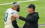 Former Minnesota Vikings player, now Detroit Lions defensive end Everson Griffen (98), greeted his former head coach Mike Zimmer at the end of the fou