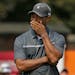 In this Aug. 21, 2015, file photo, Tiger Woods reacted after missing a putt on the ninth hole during the second round of the Wyndham Championship golf