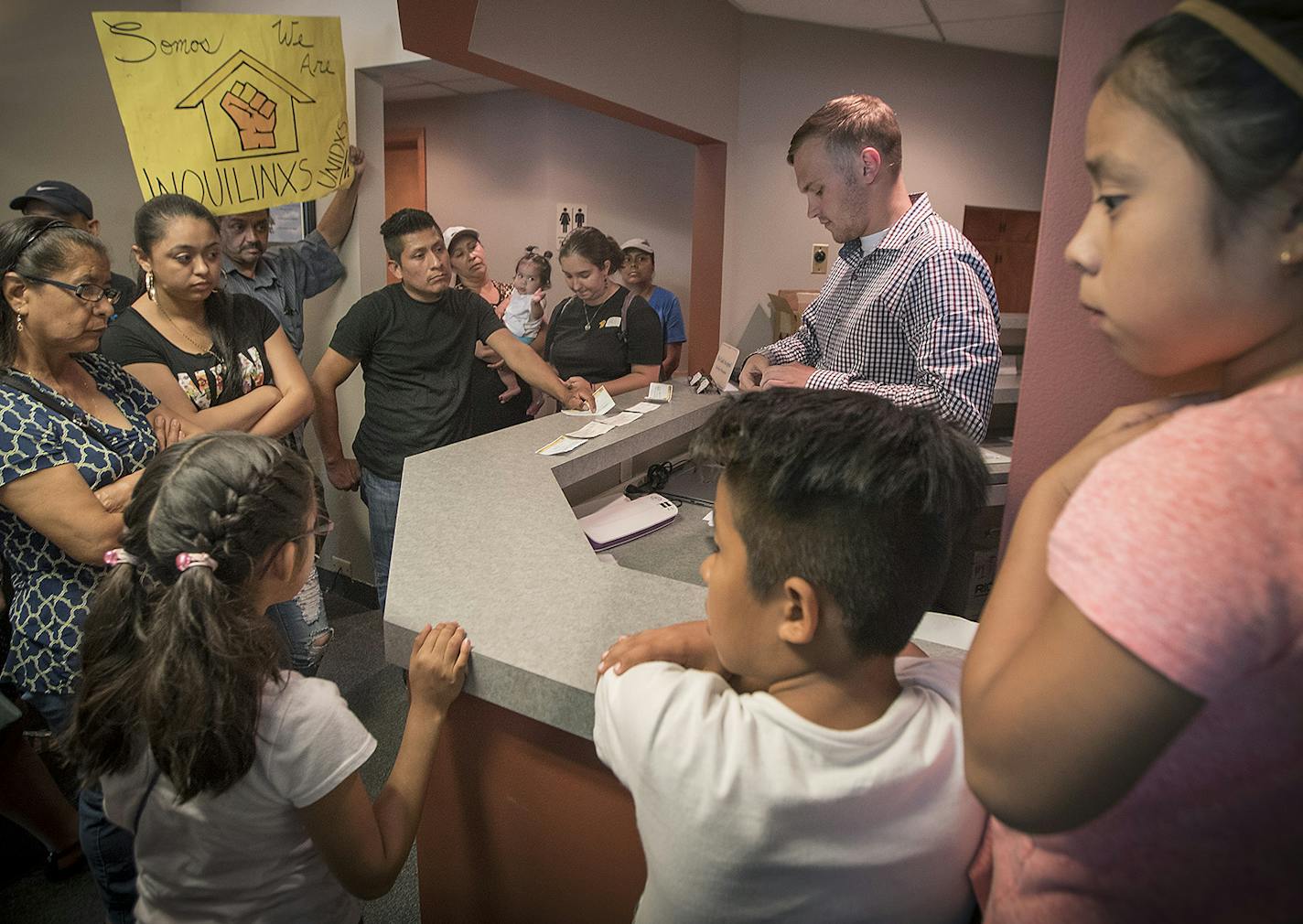 Residents and their families brought rent checks but were turned away by Nexus Real Estate Services Property Manager Steve Lubke after being forced to leave by the brand new owners who are clearing out the current tenants and raising the rents. Tuesday, August 1, 2017 in Minneapolis, MN. ] ELIZABETH FLORES &#xef; liz.flores@startribune.com