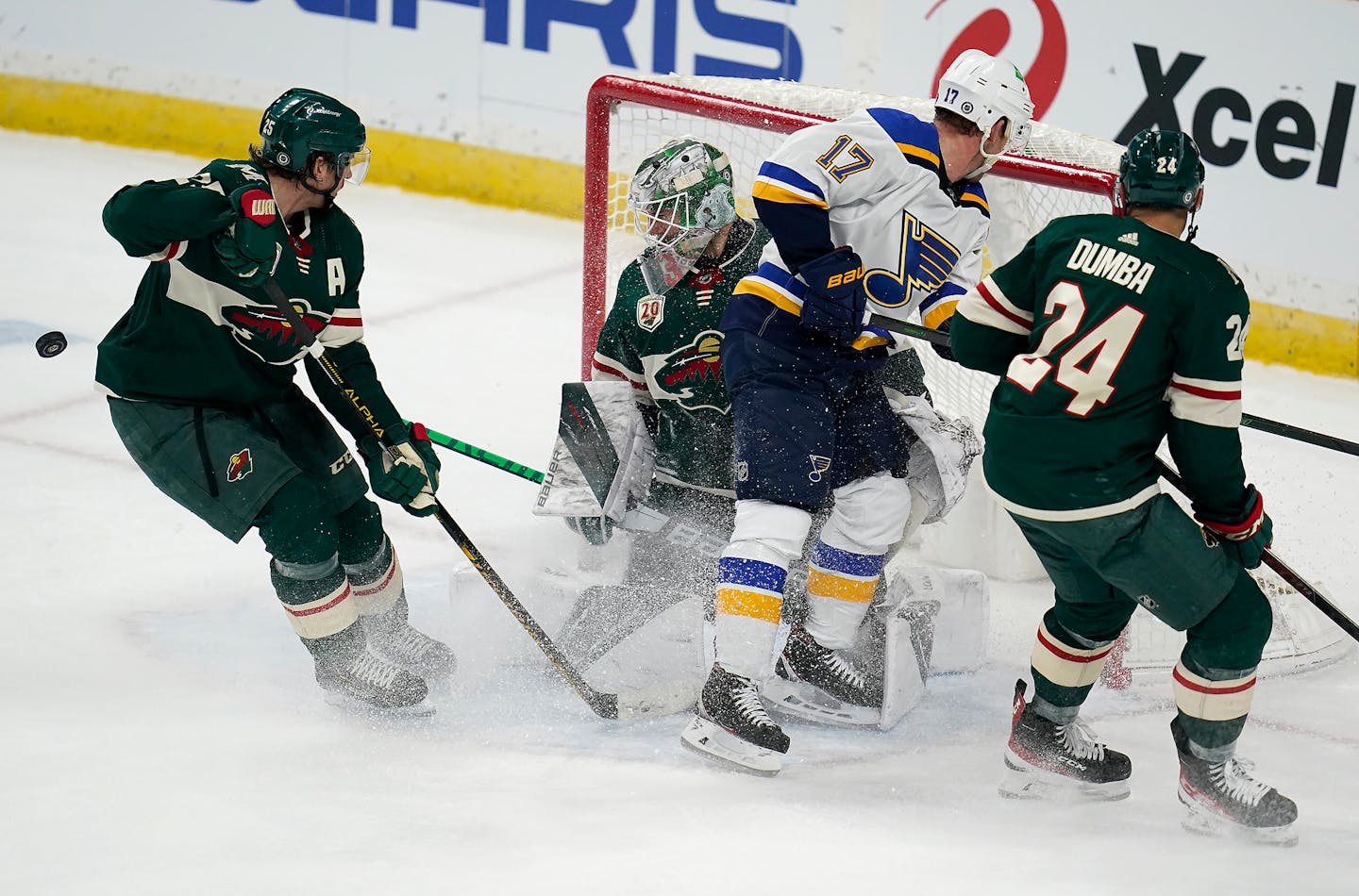 Minnesota Wild goaltender Cam Talbot (33) defended the goal with Minnesota Wild defenseman Jonas Brodin (25), left, and Minnesota Wild defenseman Matt Dumba (24), right, as St. Louis Blues left wing Jaden Schwartz (17) stayed close looking to score during the third period. ] LEILA NAVIDI • leila.navidi@startribune.com