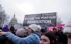 FILE — People participate in the annual March for Life in front of the U.S. Supreme Court in Washington on Jan. 21, 2022. The Supreme Court privatel